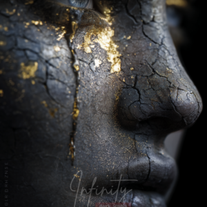 Side-profile digital portrait of a cracked stone face with subtle gold-filled fractures and a calm, introspective gaze.